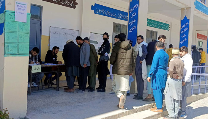 People waiting for their turn at a polling station during General Elections 2024, held in Abbottabad on February 8, 2024. — PPI