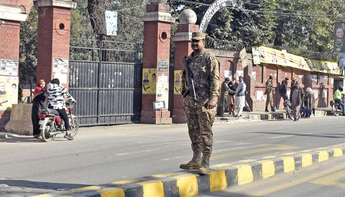 Park Army soldiers stand alert outside a polling station during the countrys parliamentary elections in Lahore on February 8, 2024. — Online