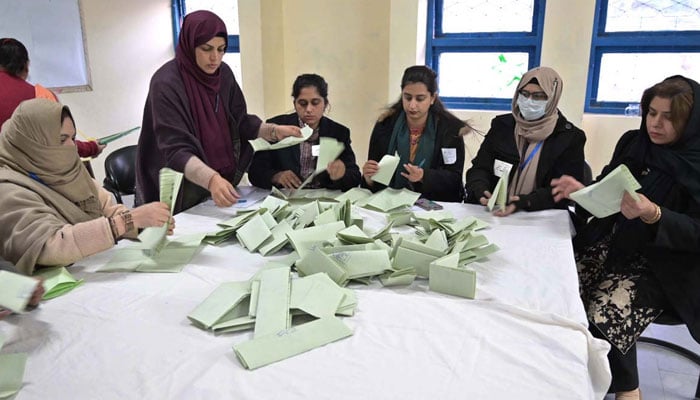 Polling officials count votes at a polling station in the F-6 area during the General Elections 2024 on February 8, 2024. — APP