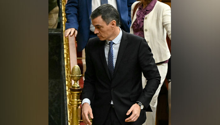 Spains PM Pedro Sanchez (L) leaves a plenary session after a vote on the governments controversial amnesty bill, at the Congress of Deputies in Madrid on January 30, 2024. — AFP