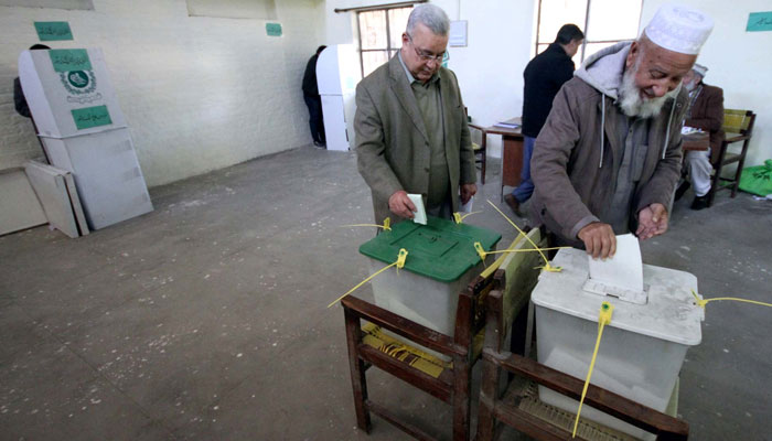The ballot casting process is underway at the polling station during General Elections 2024, held in Peshawar on February 8, 2024. — PPI