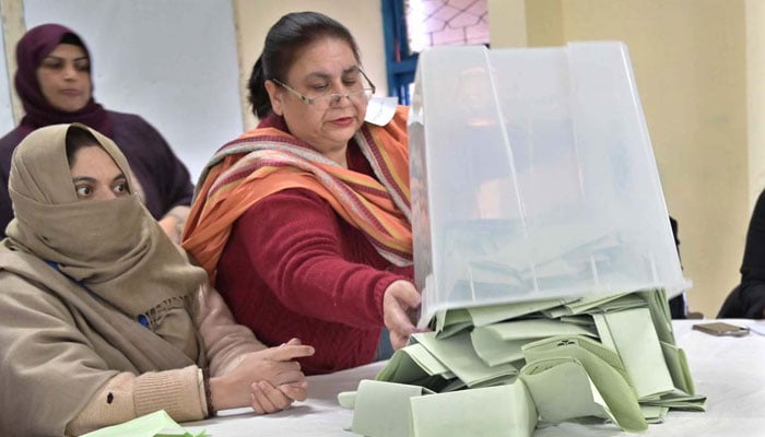 Polling official opens ballot boxes to count votes at a polling station in the F-6 area during General Elections-2024 on February 8, 2024. — APP