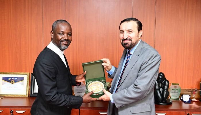 Deputy Speaker of Uganda’s Parliament Thomas Tayebwa presents a shield to Islamabad High Commissioner of Pakistan in Uganda Muhammad Hassan Wazir on February 9, 2024. — X/@Thomas_Tayebwa
