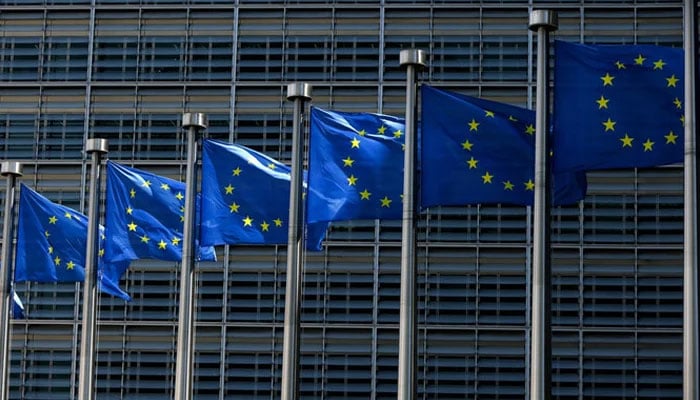 European Union Flags fly outside the European Commission building in Brussels, Belgium. — AFP/File