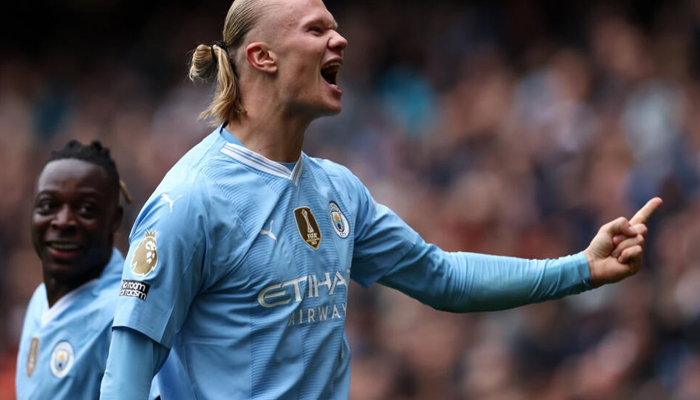 Manchester City striker Erling Haaland celebrates scoring against Everton. — AFP