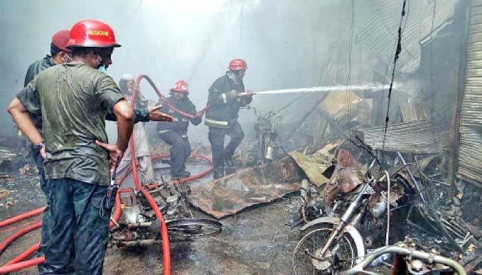 Rescuers make efforts to put out a blaze that caused havoc in Rawalpindi. — APP/File