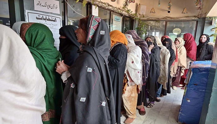Large numbers of women can be seen queuing up in front of polling stations to cast their votes in Islamabad during the General Elections 2024, on February 8, 2024. — APP