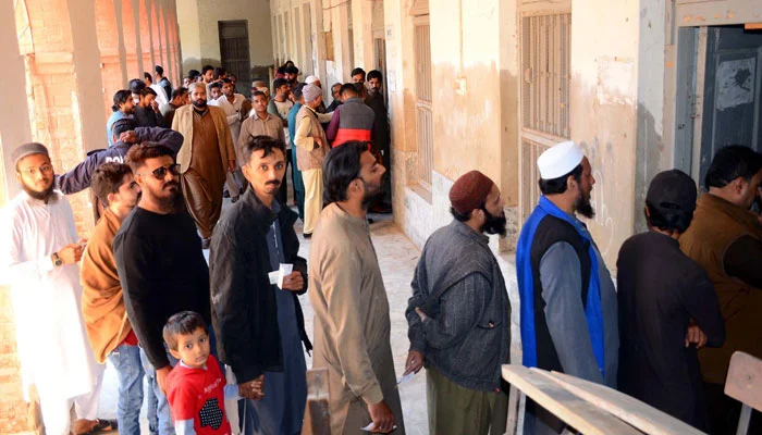 Voters are in queue waiting to cast their votes at a polling station during the General Election 2024, in Hyderabad on February 8, 2024. — PPI