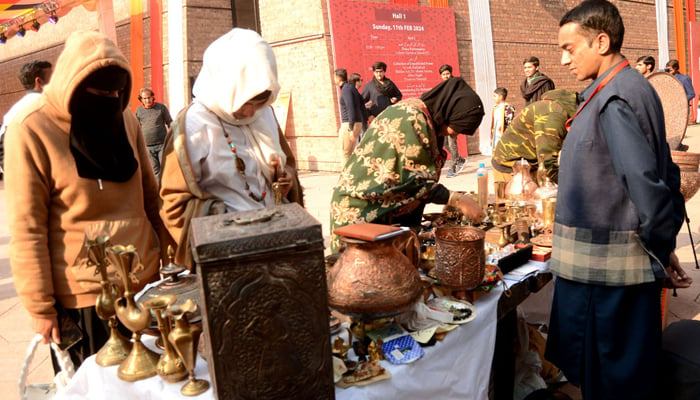 Women visiting stall during Faiz Mela at Al-Hamra in Lahore on February 11, 2024. — APP