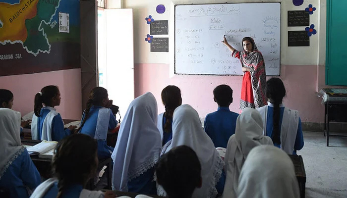 This photograph shows a teacher taking a class at a school. — AFP/File