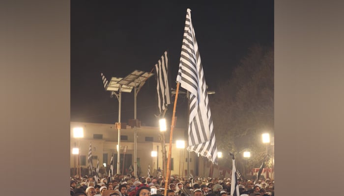 JUI-F supporters hold party flags during an election camping rally on February 7, 2024. — Facebook/Jamiat Ulama-e-Islam Pakistan
