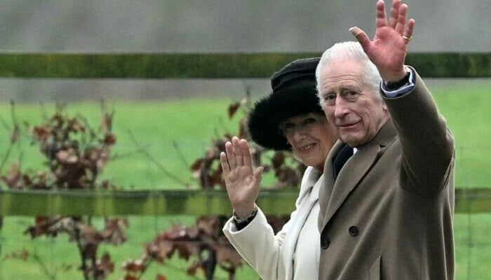 Britain’s King Charles III and Britain’s Queen Camilla waves as they leave after attending a service at St Mary Magdalene Church on the Sandringham Estate in eastern England on February 11, 2024. — AFP