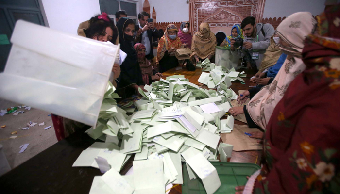 Polling Staff counts votes after the ballot casting process at a polling station during General Election 2024, in Peshawar on Thursday, February 8, 2024. — PPI