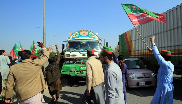 Activists of Tehreek-e-Insaf (PTI) are block roads as they are holding a protest demonstration against alleged rigging in General Election 2024, at M1 Motorway in Peshawar on Sunday, February 11, 2024. —PPI