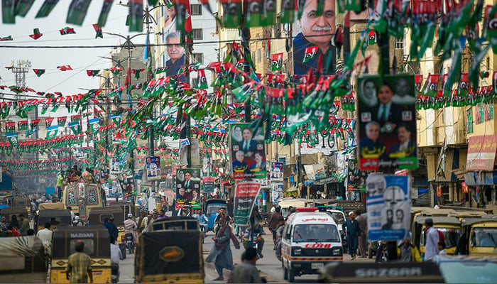 Pakistan Peoples Party (PPP) flags are hung across a street in Karachi on February 2, 2024, ahead of the general elections. — AFP