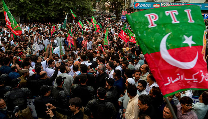 Activists of the PTI party protested on a street against the disqualified decision of former prime minister Imran Khan. — AFP/File