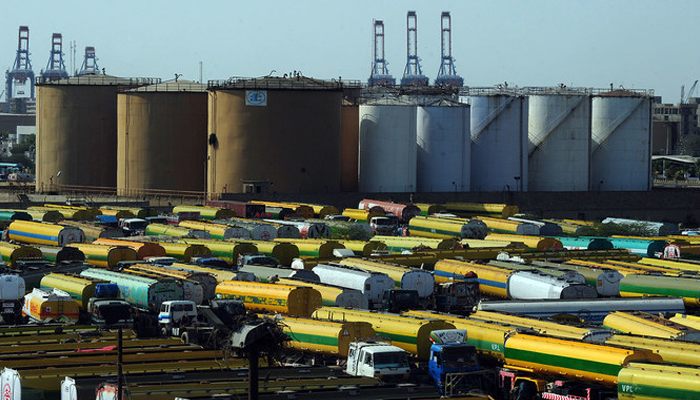 In this file photo, an overview shows tankers parked outside a local oil refinery in Karachi. — AFP/File