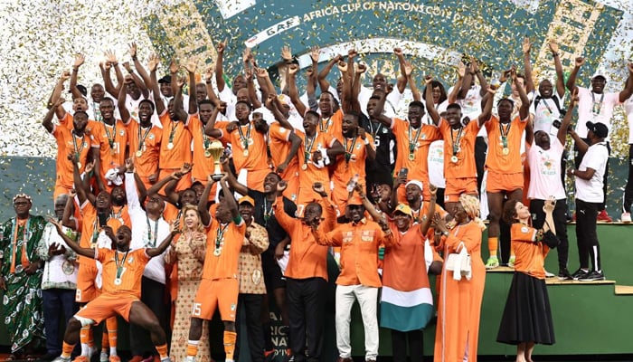 Ivory Coast players and staff celebrate winning the AFCON title. — AFP