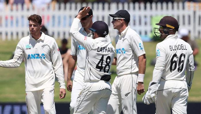 New Zealand players celebrate together after taking a wicket. — AFP/File