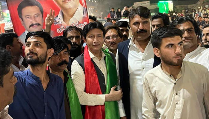 Former Member Punjab Assembly (MPA) Chaudhry Adnan (c) among his supporters during a party rally on May 15, 2022. — Facebook/Chaudhary Muhammad Adnan