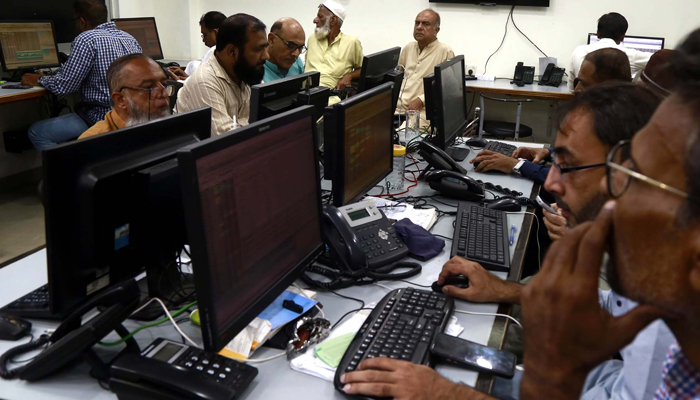 Brokers are busy trading at the Pakistan Stock Exchange (PSX) in Karachi on Monday, February 12, 2024.— PPI