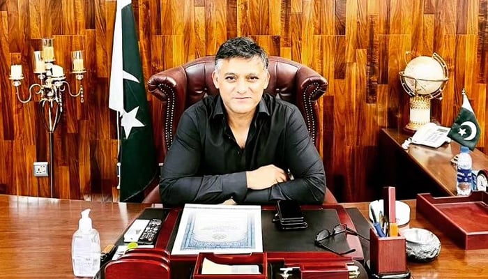 Dr. Junaid Ali Shah, the caretaker provincial sports minister sits in his office in this image released on August 21, 2023. — Facebook/Syed Junaid Ali Shah