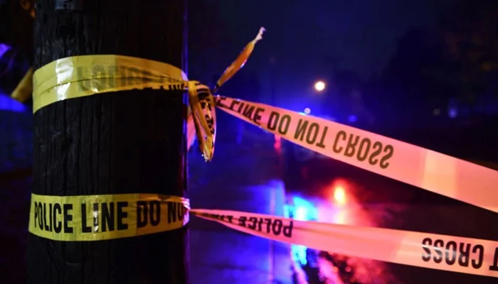 This image shows a police tape at the crime scene. — AFP/File