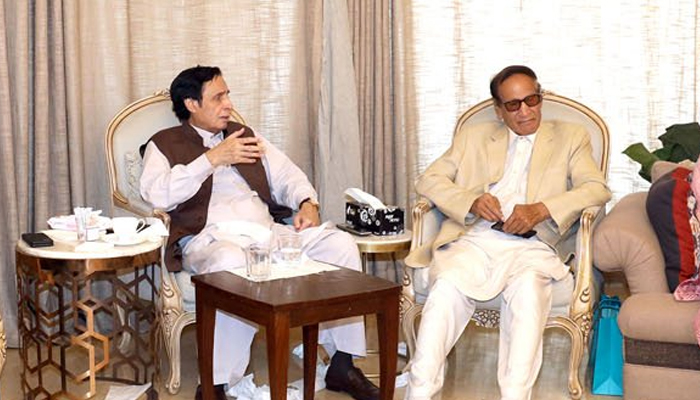 Former prime minister and president of Pakistan Muslim League Quaid Chaudhry Shujaat Hussain (R) sits as former CM Punjab Chaudhry Parvez Elahi speaks in this image released on July 12, 2022. — Facebook/Chaudhry Parvez Elahi