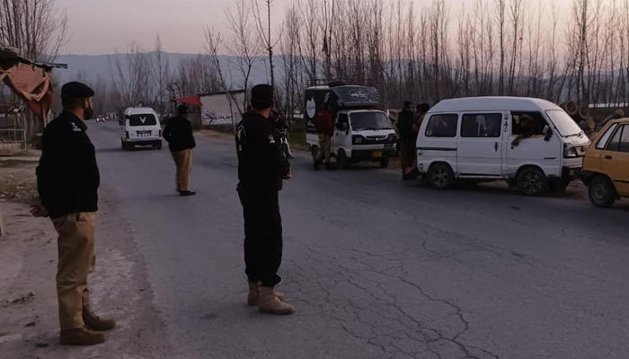 Mansehra Police personnel standing on a road during a checkpoint in this image on February 15, 2024. — Facebook/Mansehra Police