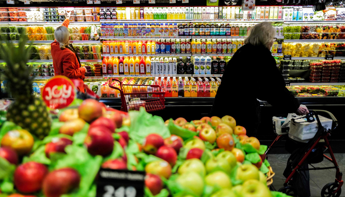 People shop in a supermarket in the Manhattan borough of New York on January 27, 2024. — AFP