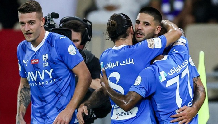 Al-Hilal team players celebrate during a match. — AFP/File