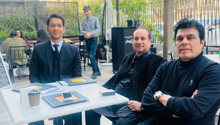 Rahat (centre) today at FIA Lahore with his lawyer Zain Qureshi (left) and singer Waris Baig. — Photo via reporter