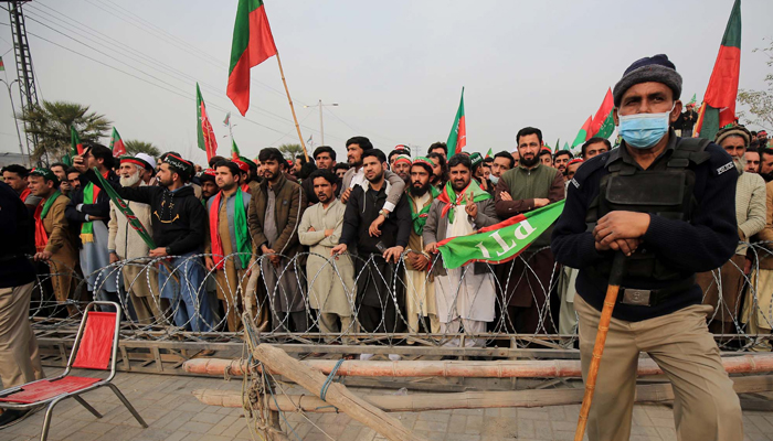 Supporters of Tehreek-e-Insaf (PTI) hold a protest demonstration against alleged rigging in General Election 2024, held at Ring Road in Peshawar on February 17, 2024. — PPI