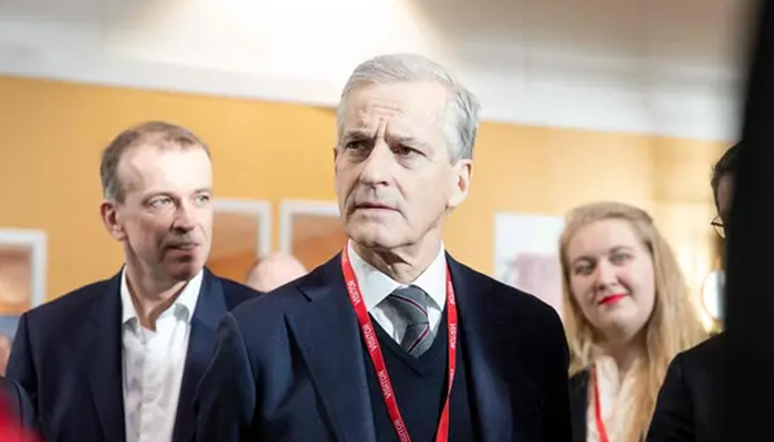 Norways Prime Minister Jonas Gahr Store (C) is seen during a visit at the Kongsberg Defence & Aerospace weapons factory in Kongsberg, Norway on January 30, 2023. — AFP