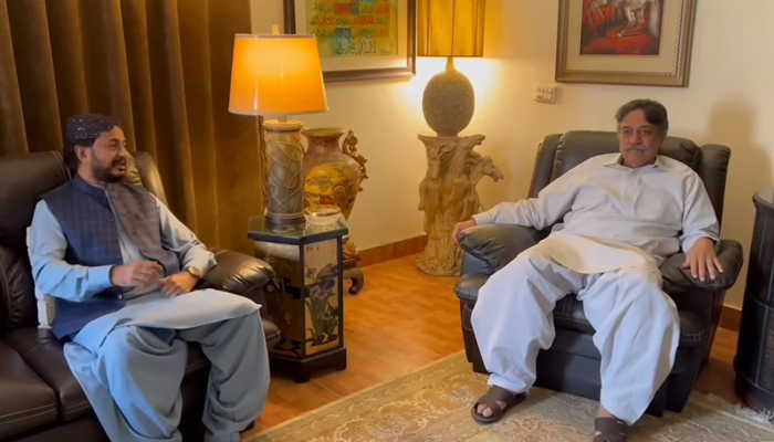 PTI Sindh president Haleem Adil Sheikh (L) meets with GDA central leader Sadruddin Shah Rashidi at the latter’s residence in Karachi on February 18, 2024. — Facebook/Haleem Adil Sheikh