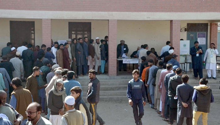 People wait their turn to cast their vote at a polling station during the countrys parliamentary elections on February 8, 2024. — Online