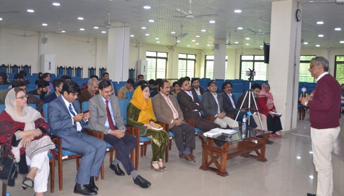 A participant speaks to the introductory talk on two different books ceremony on February 14, 2024. — Facebook/Punjab University Library