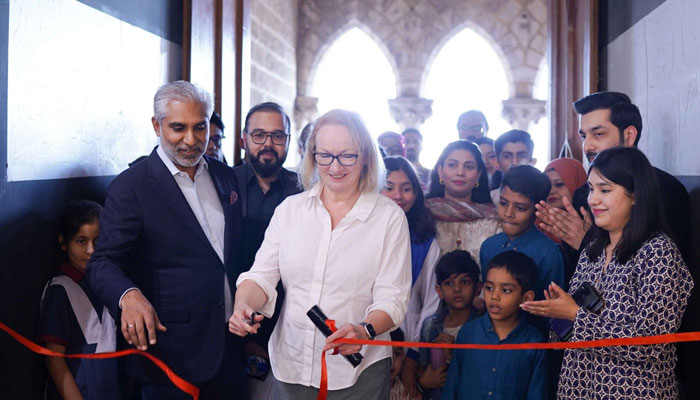 The image released on Feb 19, 2024 shows British Deputy High Commissioner, Sarah Mooney inaugurating the 10th Art for Change exhibition at Frere Hall, Karachi. — x/BDHC_Sarah