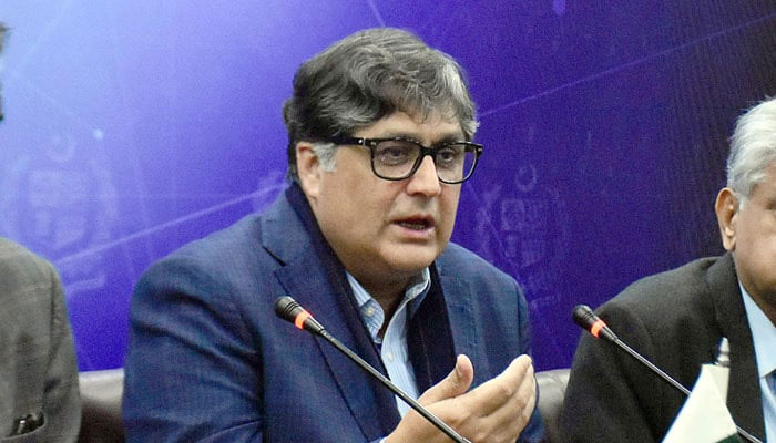 Caretaker Federal Minister for Privatisation and Minister for Inter Provincial Coordination Fawad Hasan Fawad addressing a press conference at the Press Information Department in Islamabad on December 21, 2023. — Online
