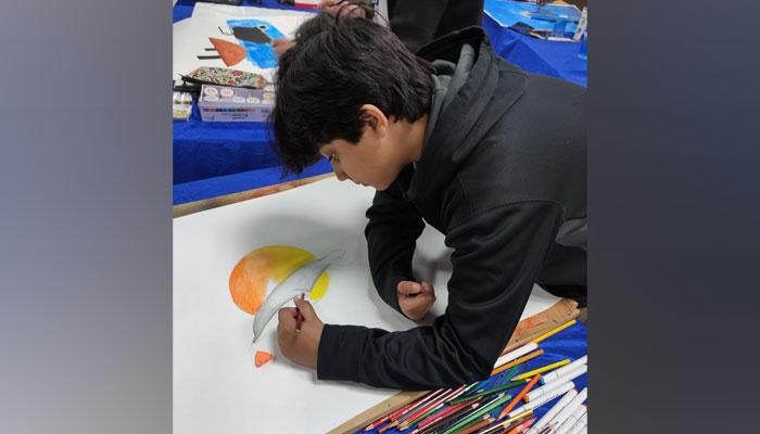 A school student make poster design participate in the poster design competition on February 20, 2024. — Fcaebook/Riphah International University