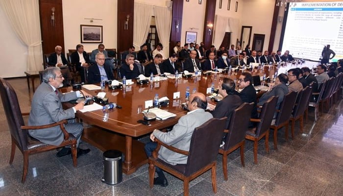 Sindh caretaker chief minister Justice (retd) Maqbool Baqar chairs a meeting at CM House to address civic issues in the city of Karachi on December 26, 2023. — X/@SindhCMHouse