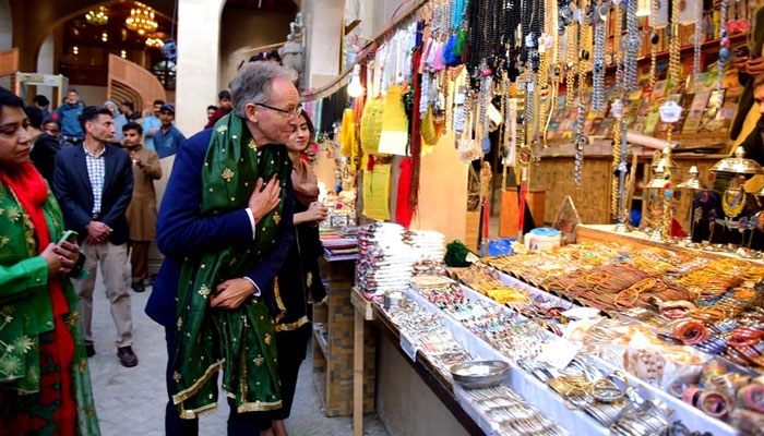 Australian High Commissioner, H.E Neil Hawkins with Embassy delegation visits stall during visit to the shrine of Bibi Pakdaman on February 21, 2024. — APP