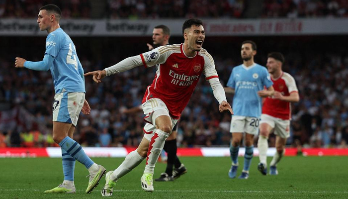 Gabriel Martinelli wheels away after scoring the winner for Arsenal against Manchester City. — AFP/File