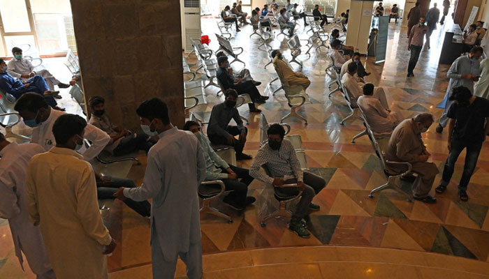 People wait their turn in a hospital, Islamabad in this file photo. — AFP/File