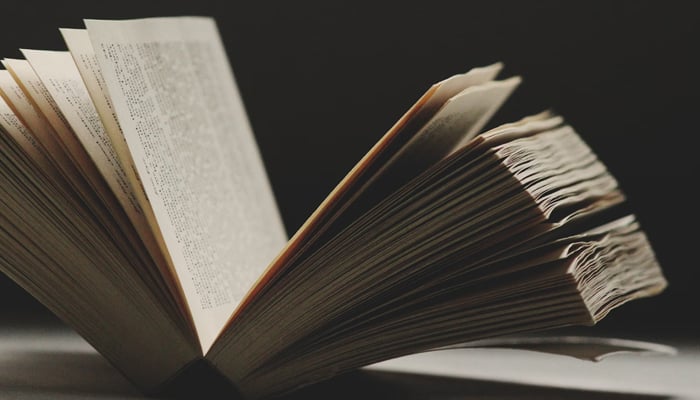 A representational image of an open book. — Unsplash