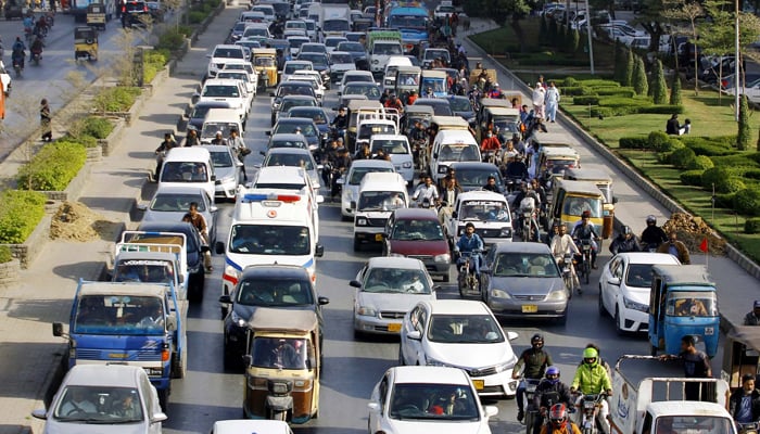 Large numbers of vehicles are seen stuck in a traffic jam at Main Korangi road in Karachi on February 19, 2024. — PPI