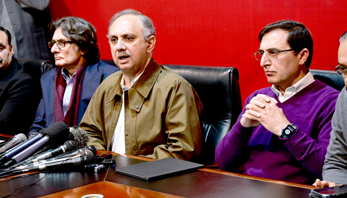 PTIs candidate for PM Umar Ayub addresses a press conference in Islamabad along with other senior leaders of the party on February 18, 2024. — APP