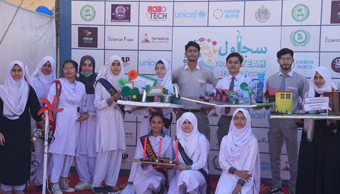 Students pose for a picture with their projects at the Sujawal Youth Stem Learning Festival on February 23, 2024. — Facebook/Thar Education Alliance
