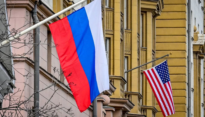 A Russian flag flies next to the US embassy building in Moscow. — AFP/File