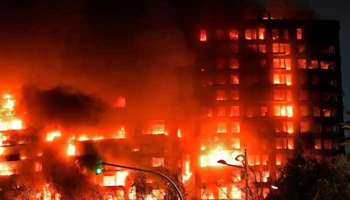 A huge fire rages through a multi-storey residential block in Valencia, on February 22, 2024. — AFP